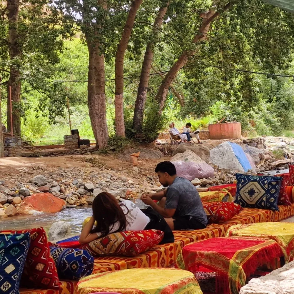 Travelers have lunch beside the Ourika River