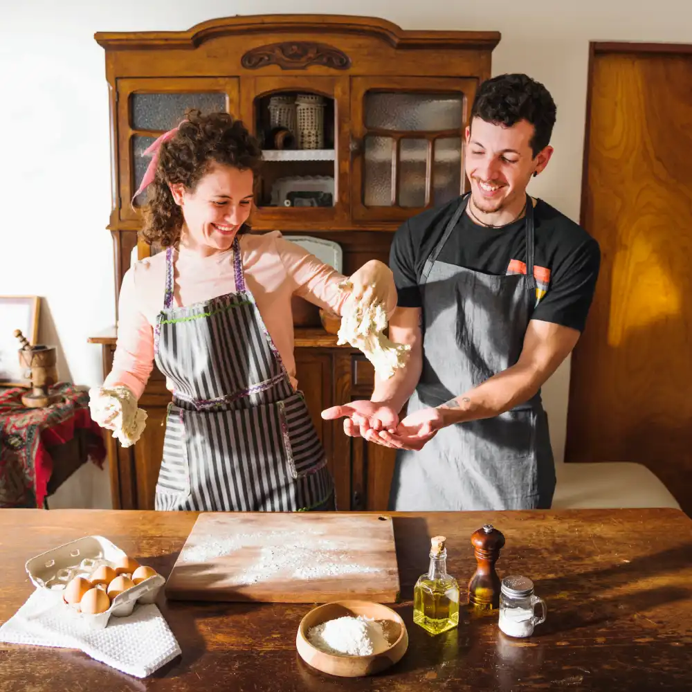 young-couple-playing-with-kneaded-dough-home