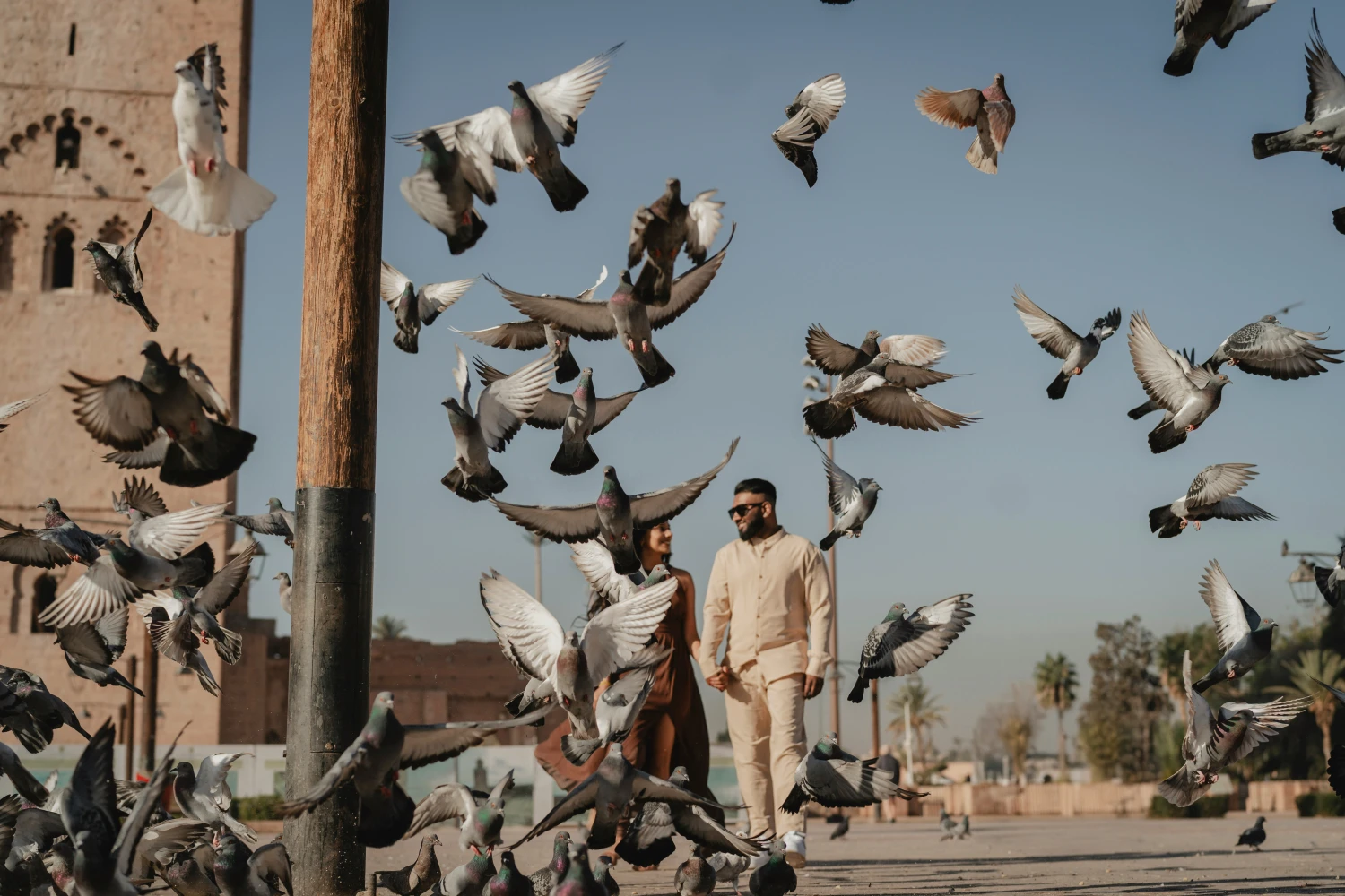 Couple walking in front of El Koutoubia