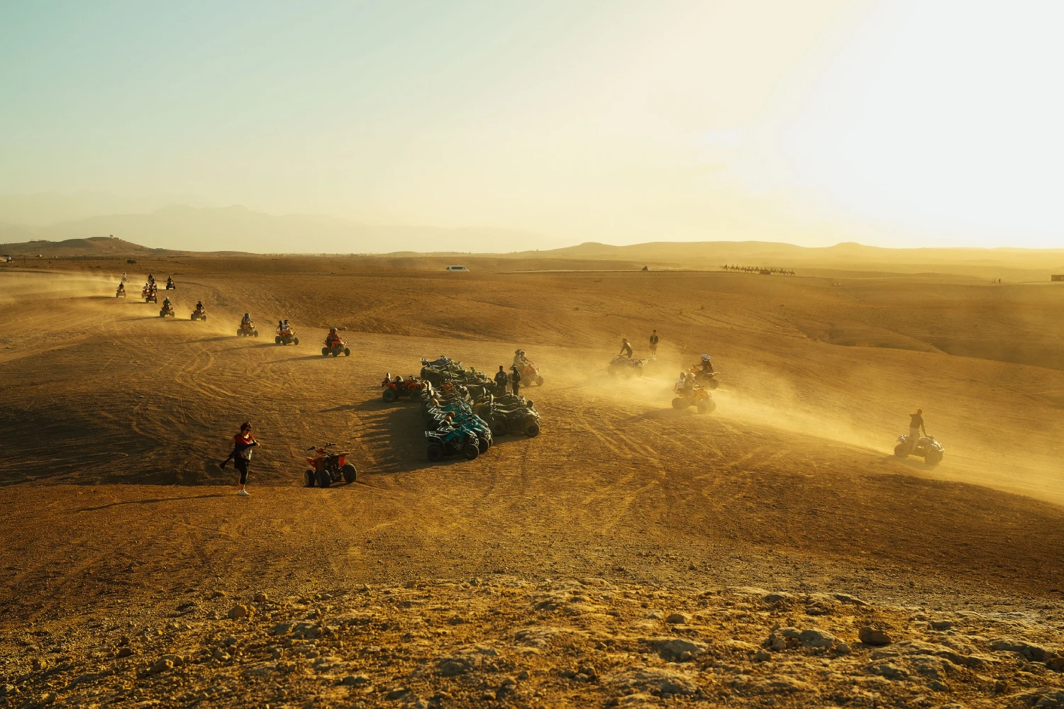 Group Of Travelers enjoy Quad in the desert