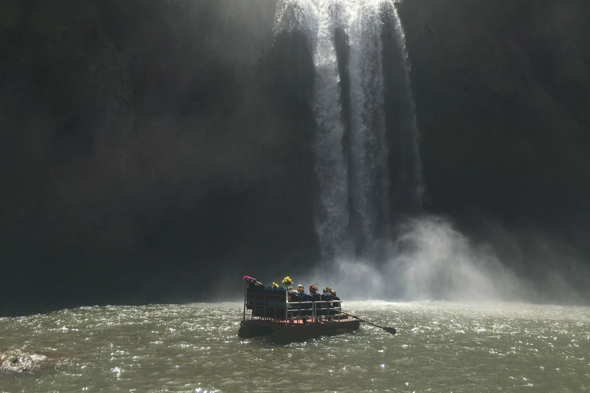 Group of Travelers Enjoy the Ouzoud Waterfalls with a Boat