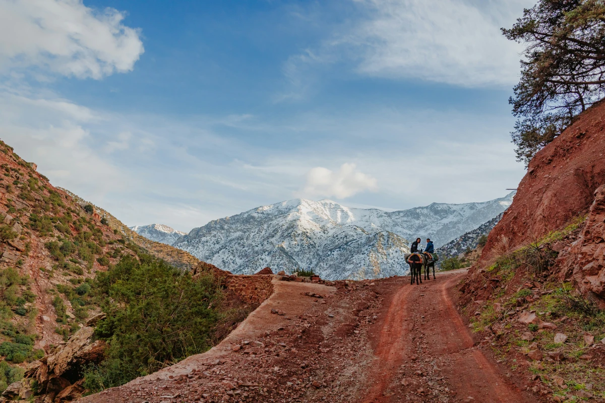 Snow on Atlas Mountains with local people