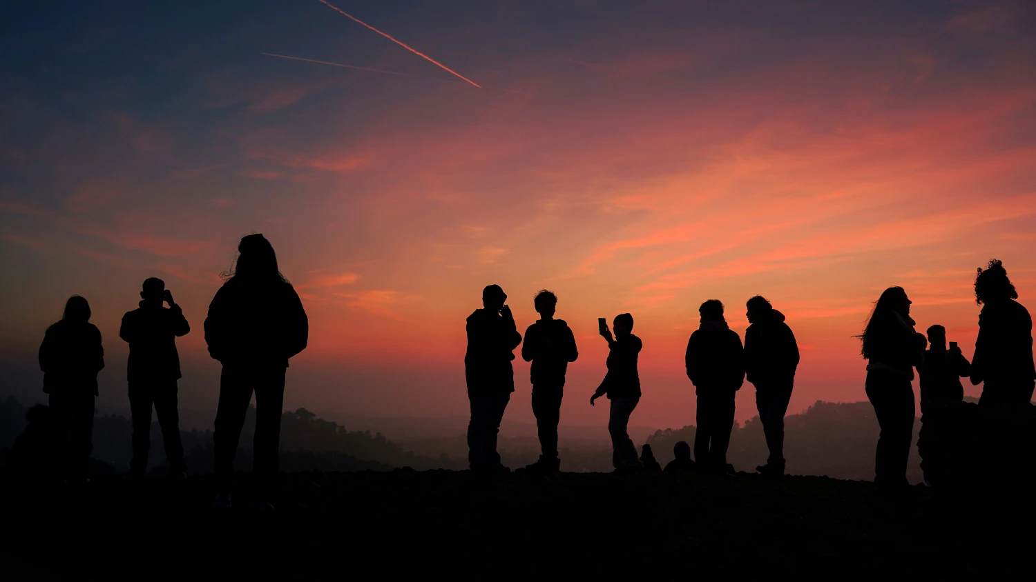 Travelers enjoy the sunset on the Atlas Mountains